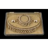 A Boxed Vintage Set of Elizabethan Faux Pearls, consisting of a necklace, earrings and bracelet.
