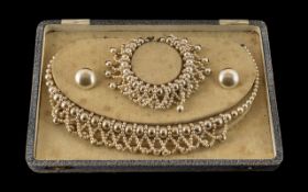 A Boxed Vintage Set of Elizabethan Faux Pearls, consisting of a necklace, earrings and bracelet.