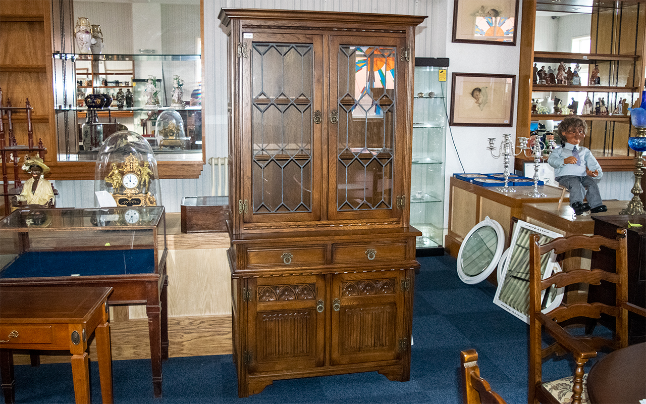 'Old Charm' Carved Oak Glazed Top Cabinet in the Jacobean style, with a leaded glass top,