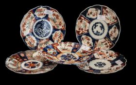 Five Small Antique Imari Plates of Lobed shape, decorated in traditional Imari colours and