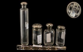 Four Silver Topped Glass Trinket Bottles,