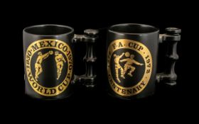 Two Portmeirion Black on Gold Tankards, celebrating 1930-1970 Mexico World Cup, and 1872-1972 F.A.