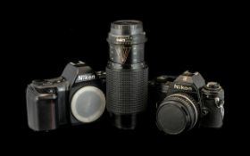 Two Nikon Cameras: 1/ F-601M with Tokina-macro lens, 2/ Nikon EM No.