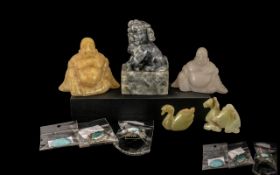 Small Collection of Chinese Carvings comprising a foo dog, two carved agate figures of Buddha, a