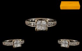 18ct White Gold Diamond Ring set with four central Princess cut diamonds between diamond cut