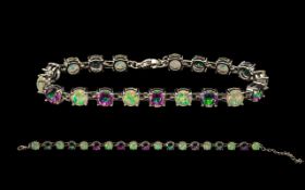 A Contemporary Mystic Topaz And Opal Style Set Silver Tennis Bracelet - Comprising 19 Stones Of