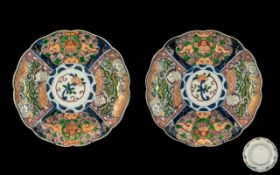 Pair of Antique Imari Dishes of Lobed Shape decorated to the panels with floral and bird designs.