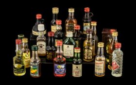 Twenty Miniature Bottles of Spirits in tin container;