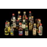 Twenty Miniature Bottles of Spirits in tin container;