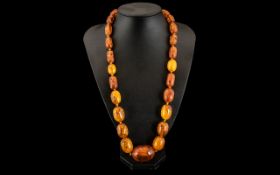 Faux Amber Bead Necklace, the twenty five graduated beads of large size,
