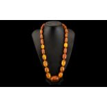 Faux Amber Bead Necklace, the twenty five graduated beads of large size,