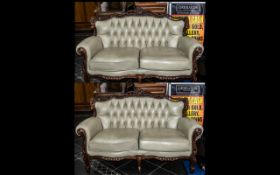 Pair of Italian Carved Walnut Framed Leather Sofas, two seaters,