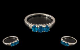 Neon Apatite and Diamond Ring, three oval cut neon apatites, the unique bright, deep turquoise