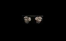 Diamond 'Triple Knot' Stud Earrings, the triple knot setting holding .