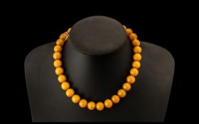 Amber/Bakelite Choker/Necklace. Early 20th Century necklace with gold tone clasp, 16" in length.