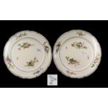 Pair of French Style Serves Plates decorated with flowers, with a shaped edge. Marks to verso.