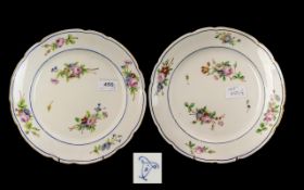 Pair of French Style Serves Plates decorated with flowers, with a shaped edge. Marks to verso.