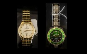 Two Gentleman's Fashion Watches comprising a Westar watch with a gold tone bracelet strap,