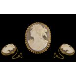 9ct Gold Mounted Oval Shaped Shell Cameo Brooch with Attached Safety Chain.