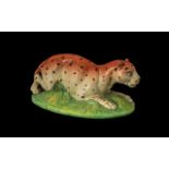 Rare Staffordshire Pearlware Figure of a Reclining Leopard on a mossy bank;