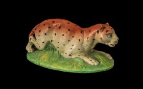 Rare Staffordshire Pearlware Figure of a Reclining Leopard on a mossy bank;