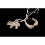 Leopard Head Torque Style Ring and Elephant Pendant, the ring having two detailed leopards heads,