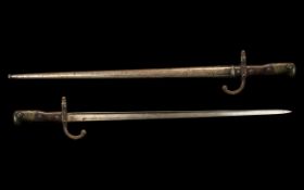 French 19th Century Sword Bayonet with Scabbard, script to edge of blade 'St. Etienne Fevrier 1883'.