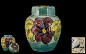 Walter Moorcroft Signed Tubelined Lidded Ginger Jar 'Anemone' design on pale bluey green ground,