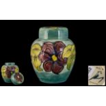 Walter Moorcroft Signed Tubelined Lidded Ginger Jar 'Anemone' design on pale bluey green ground,