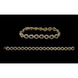 Ladies - Attractive 10ct Gold Baguette Diamond Set Tennis Bracelet of Contemporary Design. Marked