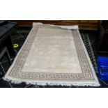 Large Indian Rug in cream with beige border and tassels. Measures approx 61" wide x 96" long.