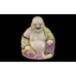 Small Chinese Republic Famille Rose Decorated Buddah Figure, sitting and smiling.
