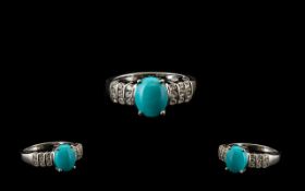 Sleeping Beauty Turquoise and White Zircon Ring, an oval cut cabochon of over 2cts of the bright,