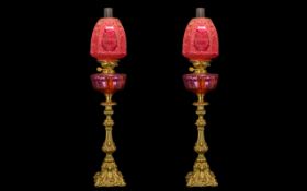 Pair of Ruby Glass Oil Lamps of Large Size with matching ruby glass shades, font and funnel,