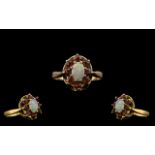 Ladies 9ct Gold - Attractive Ruby and Opal Set Ring, Flower head Setting. Fully Hallmarked for 9.