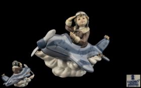 Lladro - Hand Painted Porcelain Figure ' Over The Clouds ' Little Boy Pilot. Model No 5697.