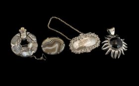 Antique Period Good Quality Pair of Polished Scotch Pebble Silver Mounted Brooches, circa 1900.