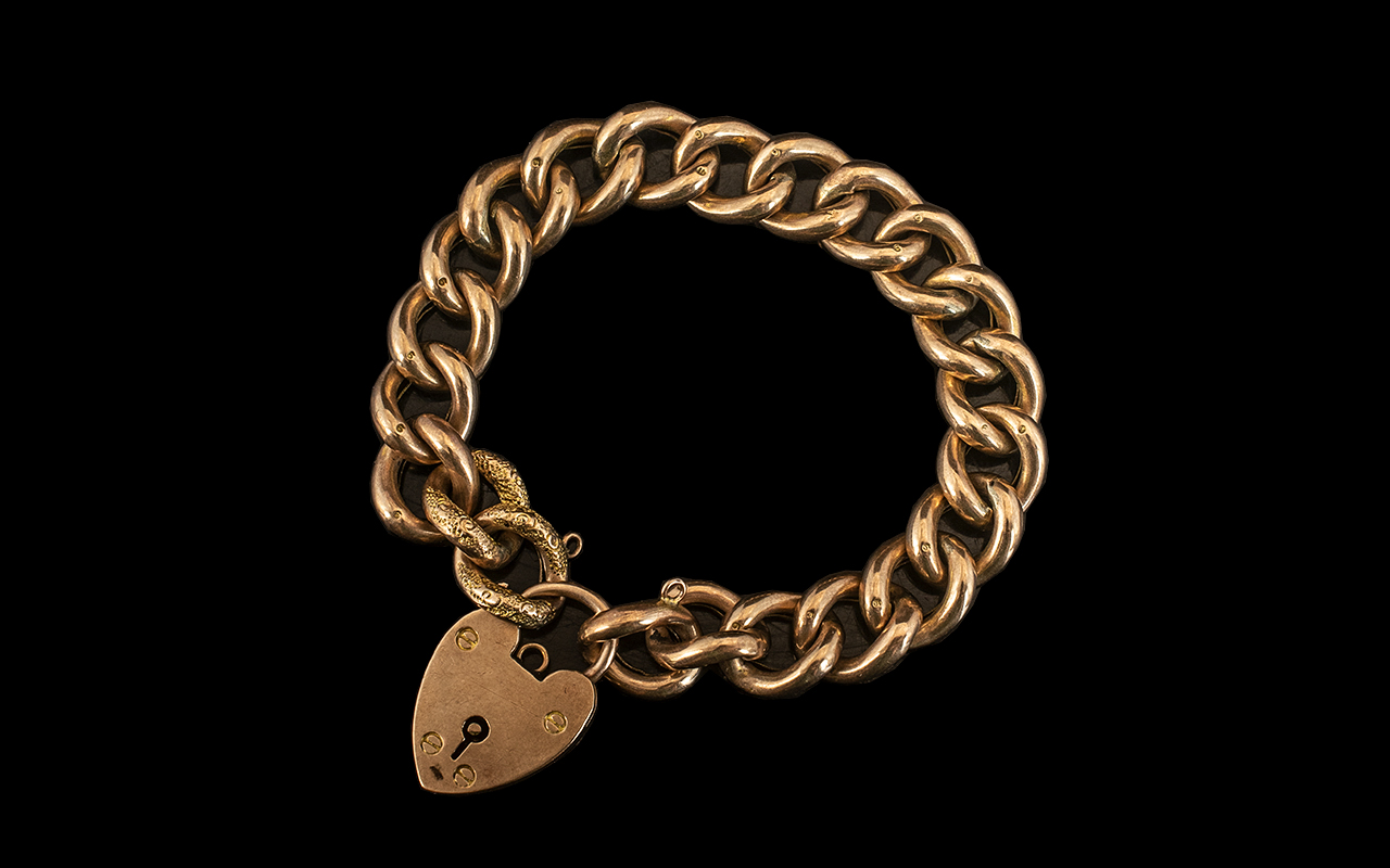 Antique Period 9ct Gold Curb Bracelet with attached large 9ct gold heart shaped padlock.