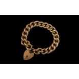 Antique Period 9ct Gold Curb Bracelet with attached large 9ct gold heart shaped padlock.