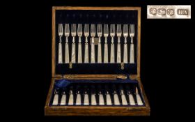 A Superb Quality Boxed Set of 24 Silver and Pearl Handles Fish Knifes and Forks.