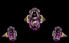 Ladies 9ct Yellow Gold Single Stone Amethyst Set Dress Ring, Raised on Open Worked Setting.