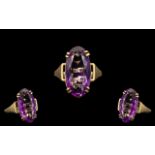 Ladies 9ct Yellow Gold Single Stone Amethyst Set Dress Ring, Raised on Open Worked Setting.