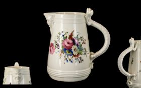 Antique Porcelain Floral Decorated Jug with an unusual lizard handle and a mask head spout.