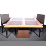 A contemporary dining table and sideboard, together with set of eight associated chairs.