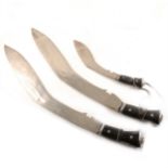 Three modern kukri knives.