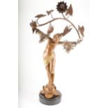 An Art Nouveau patinated spelter figural lamp, signed L Beck, circa 1900.