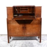 An Arts & Crafts inspired stained wood and walnut compactum secretaire, labelled Perkins Neale,