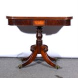 A Regency mahogany foldover tea table, rounded corners, tablet frieze, ringed column, scrolled and