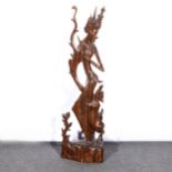 South-east Asian carved stinkwood figure of a Goddess with a deer,