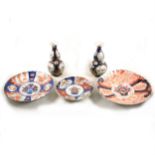 Three Imari-ware plates, plus a pair of double gourd shape vases.